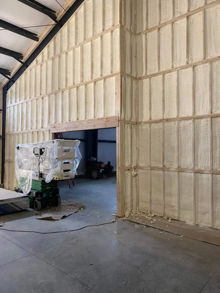 Spray foam insulation installed on the walls of a commercial building interior