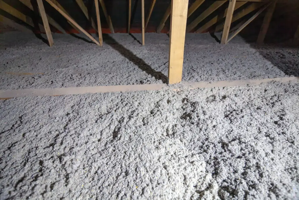 Loose-fill insulation installed across an attic floor to improve thermal performance and overall energy efficiency